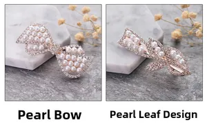 Detailed view of elegant gold hair clips with white pearls and sparkling rhinestones