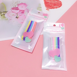 Lot de barrettes à cheveux ondulées colorées en métal aux tons pastel et emballage rose