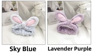 Detailed view of soft sky blue and taro purple bunny ear headbands in coral fleece fabric