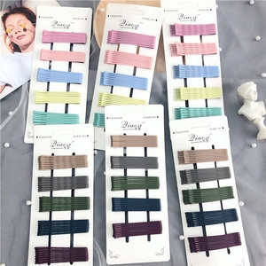 Set of colorful wave-shaped metal hairpins in macaron and dark tones for girls