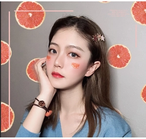 Close-up of a cute star hair clip and woven bracelet on a young model with sweet style