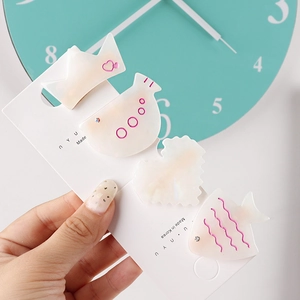 Detailed set of four Korean style hair clips with crown and bird shapes in pastel finish