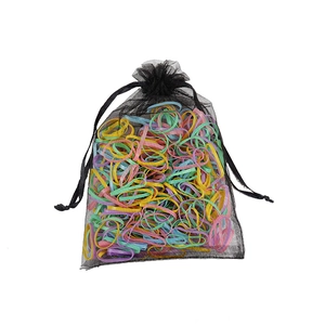 Colorful candy-colored elastic hair ties set in a black mesh bag for girls and kids
