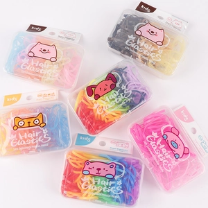 Colorful candy-colored children hair elastics set in cute cartoon boxes on white background