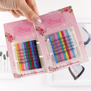 Colorful wave-shaped bobby pins set in bright matte finish on floral display card