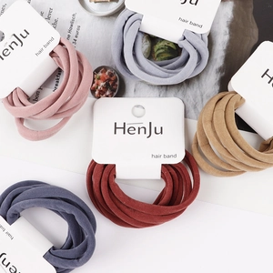 Set of 6 soft elastic high-stretch hair bands in assorted colors on cardboard display
