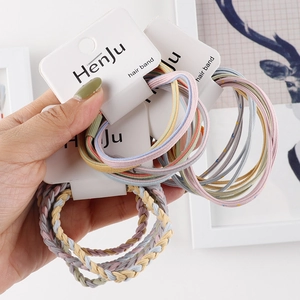 Handmade braided hair ties in macaron colors displayed on a card for women