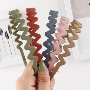 Close-up of matte Morandi wavy headbands with non-slip inner teeth for secure hair styling