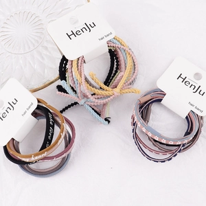 Elastic braided hair ties set with floral patterns and letter prints on white card