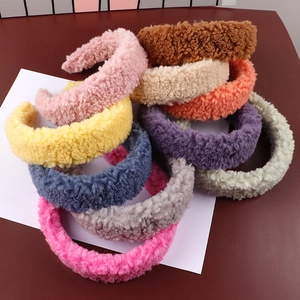 Close-up of thick plush lamb wool headbands showing soft texture and vibrant candy colors