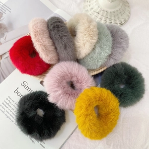 Close-up of 10-piece colorful faux rabbit fur hair scrunchies set in soft autumn tones