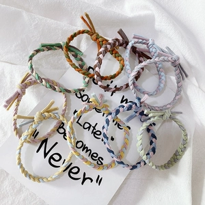 Close-up of hand-woven braided hair ties in colorful Macaron and Morandi tones