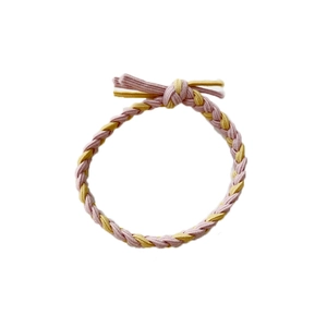 Pink and yellow braided elastic hair tie with stylish bow knot on white background