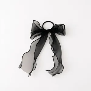 Elegant black organza bow scrunchie with sheer layered texture for women hair styling