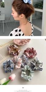 Detail view of colorful plaid fabric scrunchie set with soft elastic texture and pattern
