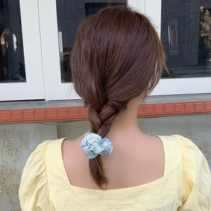Blue and white plaid oversized scrunchie worn on a ponytail for a chic French style
