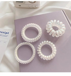 Frosted mermaid white spiral hair ties set with pearlescent finish and elastic resin