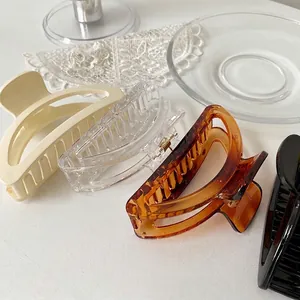 Elegant French style pearl hair claws in cream, amber, and black for women styling