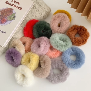 Colorful plush faux fur scrunchies set in various pastel shades for autumn and winter