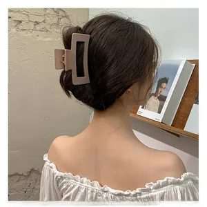 Detailed back view of a large rectangular matte nude pink claw clip for thick hair