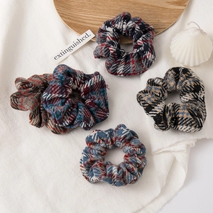Set of four plush plaid scrunchies in various British patterns for high ponytails