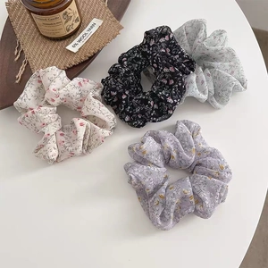 Set of four floral chiffon scrunchies in cream, black, blue and purple pastel colors