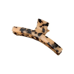 Elegant large tortoiseshell hair claw clip with golden spring and secure interlocking teeth