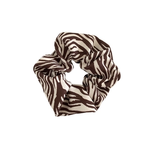 Classic zebra print fabric scrunchie in dark brown and beige with pleated elastic design