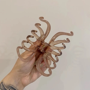Elegant large amber hair claw clip for thick hair with sleek octopus curved design
