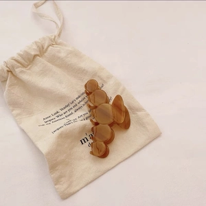 Close-up of translucent brown acetic hair claw with unique bubble design on canvas