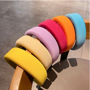 Detailed view of colorful sponge padded headbands in various vibrant candy colors
