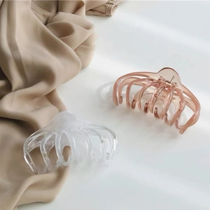 Macro shot of large octopus hair claws in transparent and amber acrylic finishes