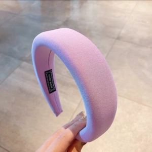 Detail of lavender padded headband with ribbed knit fabric and hand made label