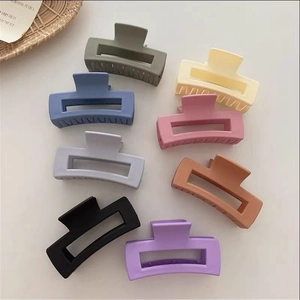 Set of 8 matte rectangular hair claws in various pastel macaron colors on a white base