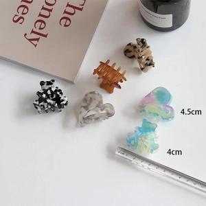 Detailed set of acetate hair claws featuring bear and heart shapes in tortoiseshell patterns
