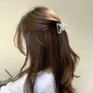 Elegant heart-shaped acetate hair claw clip for a stylish half-up hairstyle
