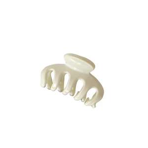 Elegant cream-colored French style hair claw clip with glossy finish on white background