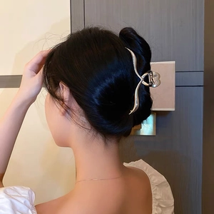 Sleek silver metal hair claw clip with heart hollow design for women long hair styling