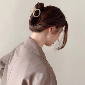 Elegant gold metal hair claw clip with interlocking hollow circles for french hairstyles