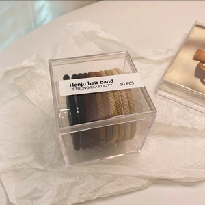 Détail de 10 élastiques à cheveux haute élasticité aux tons terre dans une boîte