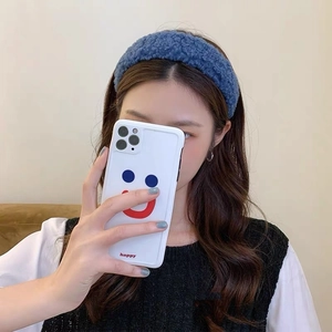 Blue fleece winter headband for women featuring thick faux lamb wool texture on model
