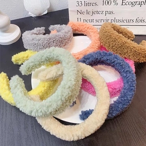 Thick plush lamb wool headband in various solid colors for winter fashion styling