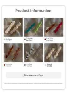 Vue détaillée de barrettes à cheveux ondulées en acétate de 6,3 cm en couleurs variées