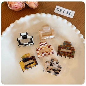 Set of six acetate square hair claws featuring leopard and checkerboard patterns in a dish
