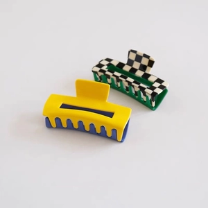 Checkboard acetate hair claw clips in forest green and vibrant yellow contrast design