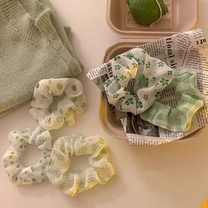 Set da cinque elastici per capelli verde chiaro con motivi floreali e a quadri