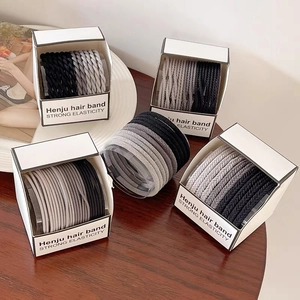 Neutral high elasticity hair ties set in a minimalist gift box on a stylish background