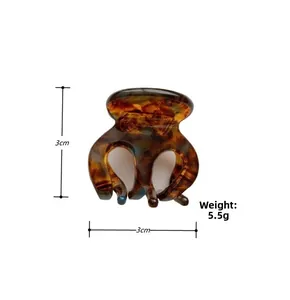 Detail view of mini acetate hair claw clip with leopard pattern, size 3cm by 3cm, 5.5g
