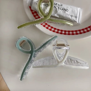 Three-piece set of Morandi color hollow hair claws with acrylic finish and metal springs