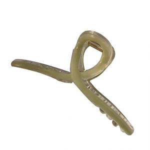 Minimalist twisted ribbon hair claw clip in sage green with golden spring mechanism